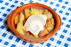 Patatas Bravas with mayonnaise. photo