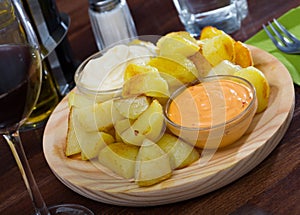 Patatas Bravas with various sauces