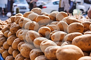 Patatoes lined on a counter of open market