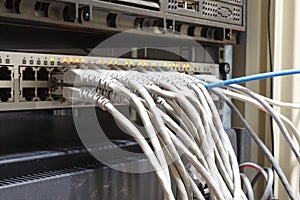 Patch Panel server rack with gray cords in the background