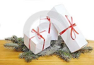 Patch of white gift boxes with red ribbon