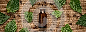 patchouli essential oil on burlap background