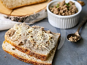 Pate of fish with mackerel, nuts, sour cream with homemade bread on gray background. Healthy breakfast, lunch, snack