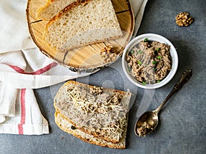 Pate of fish with mackerel, nuts, sour cream with homemade bread on gray background. Healthy breakfast, lunch, snack