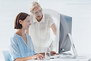 Pateint with doctor using computer