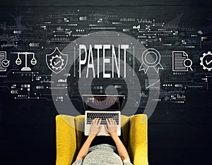 Patent concept with person using a laptop