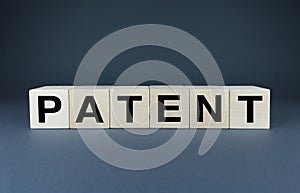 Patent. Cubes form the word Patent