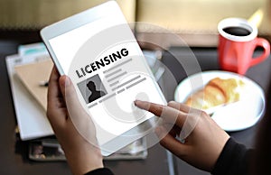 Patent License agreement LICENSING business man hand working o