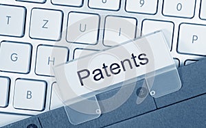 Patents - folder with text on computer keyboard photo