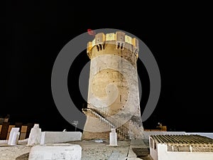 Paterna tower and cave houses at night