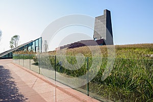 Path along glassed fence outside Luxelake Art Expo Center