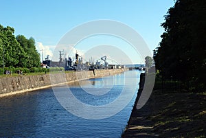 Path along the Petrovsky canal to the sea Lighthouse in the port of the city.