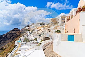 Path in beautiful Firostefani village with typical Greek white architecture, Santorini island, Greece