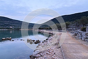 Path and calm sea near Cres after sunset in springtime