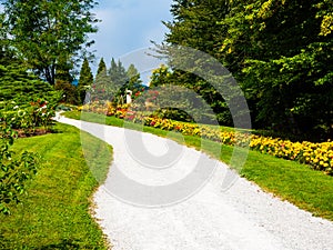 Path in a colorful european flower garden