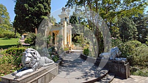 Path in a green park and trees arond