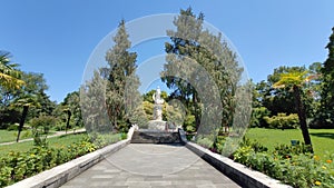 Path in a green park and trees arond