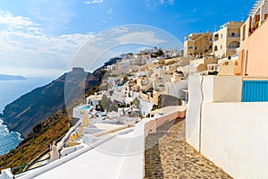 Path in Imerovigli village with typical Greek white architecture, Santorini island, Greece