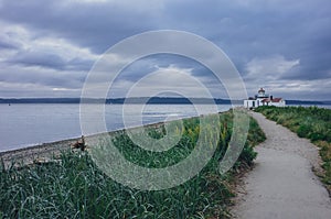Path leading to the Victorian-era lighthouse in Discovery Park, Seattle, USA