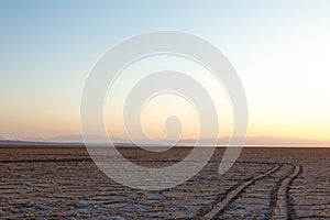 Path on Namak salt lake at Sunset, in Maranjab desert, near Kashan, Iran