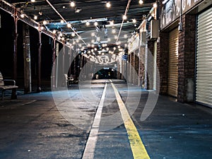 Path with Overhead Lights Outside Closed Market