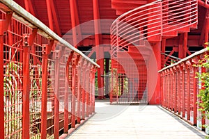 Path and revolving ladder in red photo