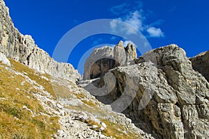 Path among roky cliff mountains of Dolomites