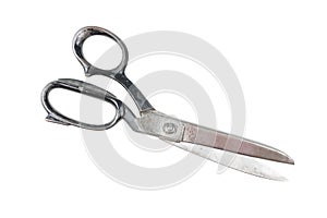 Path saved, isolated old and used metal sewing scissors