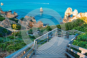 Path and stairs going down in park, way to beach in Algarve Portugal