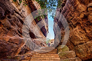 Path through steep cliffs, Entrance for lower and upper Shivalaya in Badami, Karnataka, INDIA