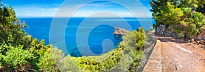 Path to the natural rock formation Sa Foradada at coast of Majorca island, panorama view