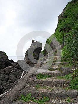 Path to Sabautsuga, the only well at the east of Irabu island. People used to go down 124 stone