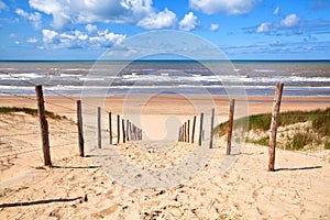 Path to sandy beach by North sea