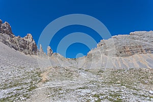 Path towards the Forcella dei Campanili in Latemar Massif, Dolomites, Italy photo