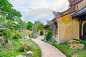 Path trough Vietnamese garden with rocks in Imperial City Hue, Vietnam Gate of the Forbidden City of Hue.