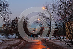 Path way with yellow lighting lanterns in Moscow Park Kolomenskoe
