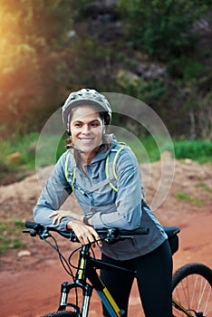 Path, woman and mountain bike in nature, fitness and cycling sports for adventure on dirt. Female person, athlete and