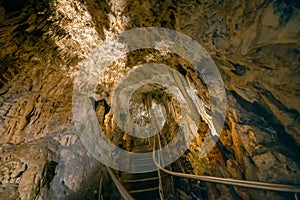 Pathway along stalactites and stalagmites formations in Demanovska cave of Liberty, Slovakia, geological rocks background