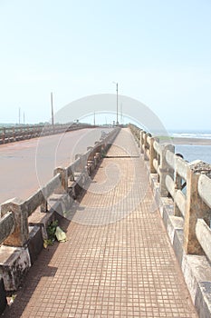 A pathway on the bridge over the creek.