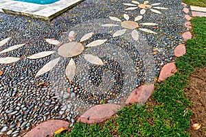 Pathway features floral pattern intricate pebble mosaic designs, in the garden of Beykoz Mecidiye Pavilion, Istanbul