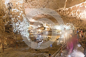 Pathway inside Sung Sot Surprise Grotto Cave with tourists