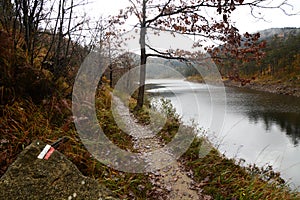 Pathway near a branch of lake Lungo. Gorzente lakes area. Parco Naturale delle Capanne di Marcarolo. Piedmont. Italy