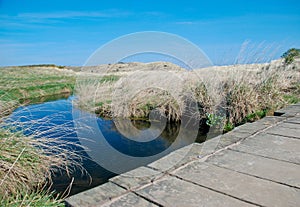 Pathway over a blue river