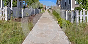 Pathway in between row of homes in Daybreak Utah