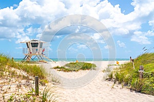 Pathway to the beach with Lifeguard hut and ocean on background in Fort Lauderdale, Florida USA