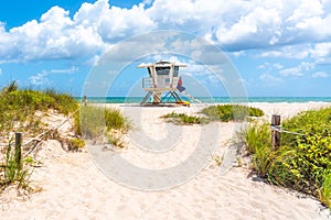 Pathway to the beach with Lifeguard hut and ocean on background in Fort Lauderdale, Florida USA