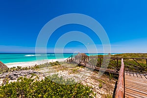 Pathway to the sandy beach Playa Paradise of the island of Cayo Largo, Cuba. Copy space for text.