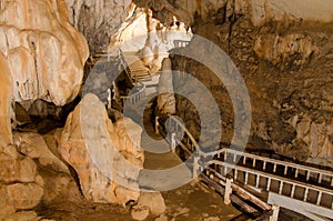 pathway underground cave in Laos, with stalagmites.