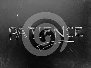 Patience Handwritten on Blackboard