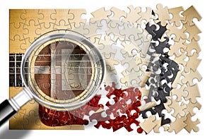 Patience and passion to learn to play the guitar step by step - concept image in puzzle shape seen through a magnifying glass